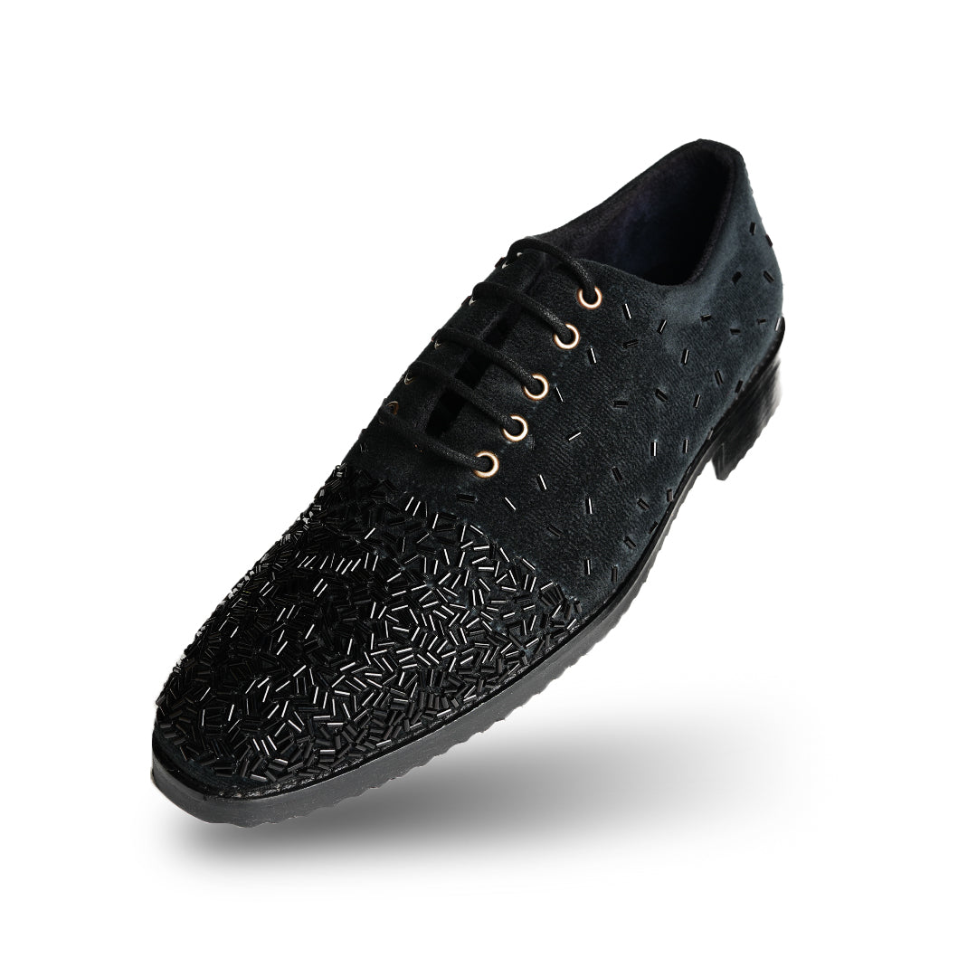 A stylish Monkstory Artisan Lace-Up - Black adorned with sequins, showcasing exquisite craftsmanship.