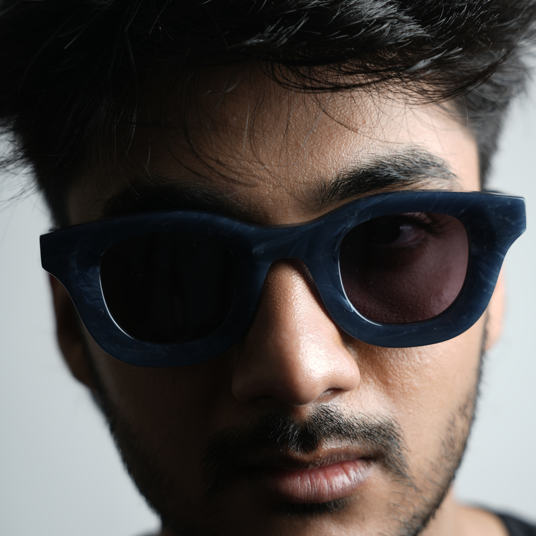 A pair of MonkStory Thick Acetate Unisex Sunglasses - Marbleous Blue on a white background.