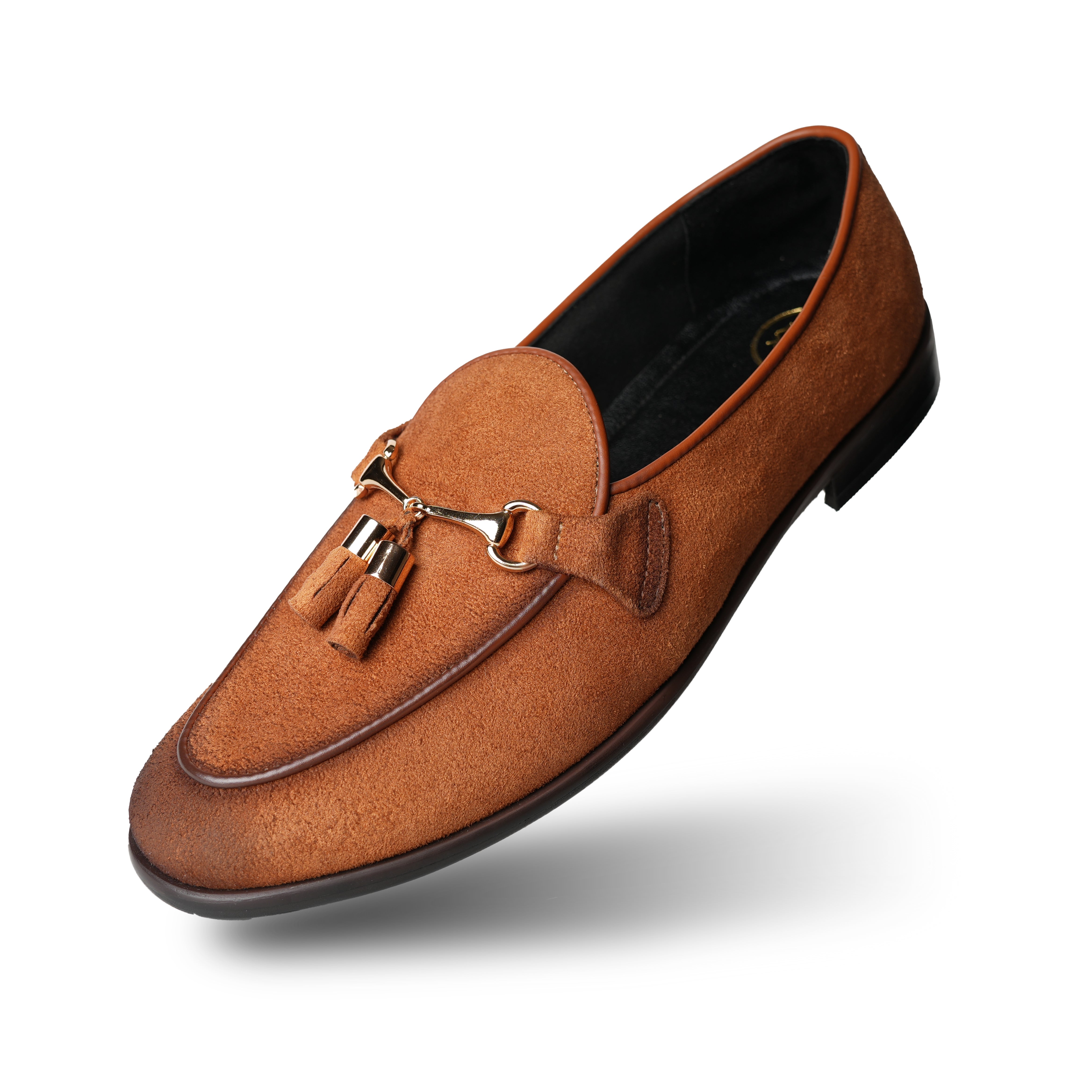 A rustic tan suede loafer, Monkstory Horse-bit Tasseled Slip-Ons - Rustic Tan, with timeless elegance.