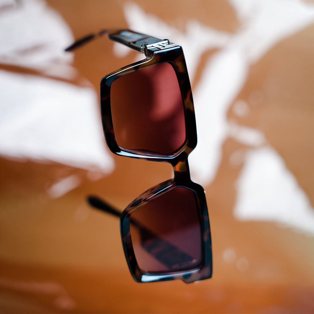 A pair of Monkstory Millionaire Unisex Wayfarer Sunglasses - Tortoise with polarized lenses.