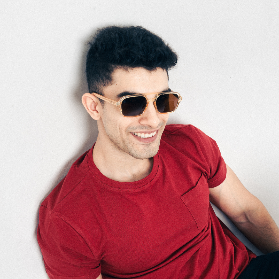 A pair of Monkstory Retro Wood Polarized Unisex sunglasses with transparent brown lenses on a white background.