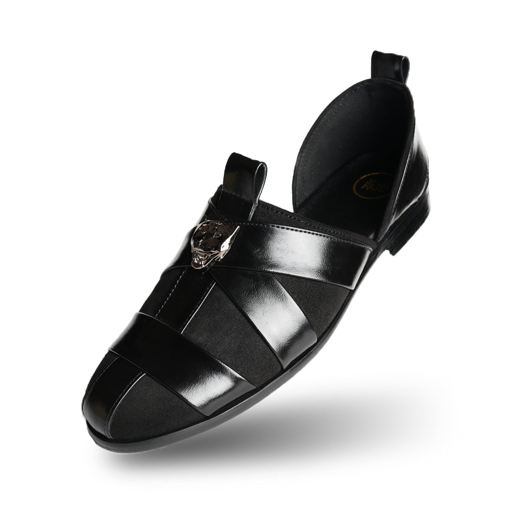 A sophisticated Monkstory Criss Cross Slip-On Sandal - Black leather shoe with straps.