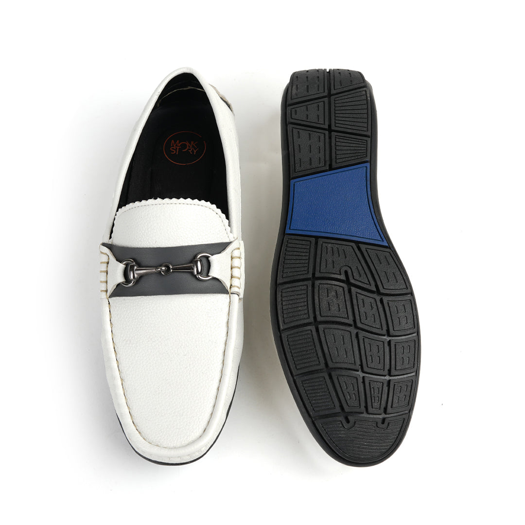 A stylish white Monkstory Horse-bit Driving Shoe with a sleek black buckle, perfect for both fashion-forward individuals and those seeking ultimate comfort.