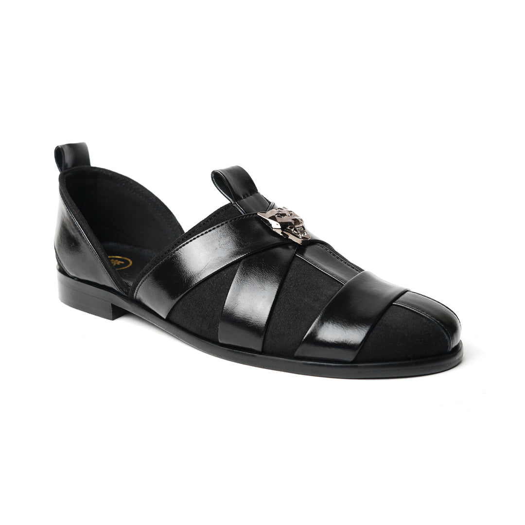 A sophisticated Monkstory Criss Cross Slip-On Sandal - Black leather shoe with straps.