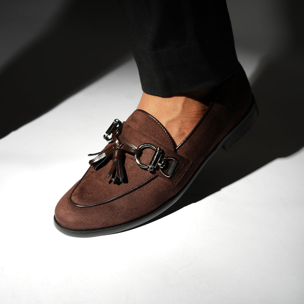 A timeless Monkstory brown loafer with tassels and a buckle, exuding modern sophistication.