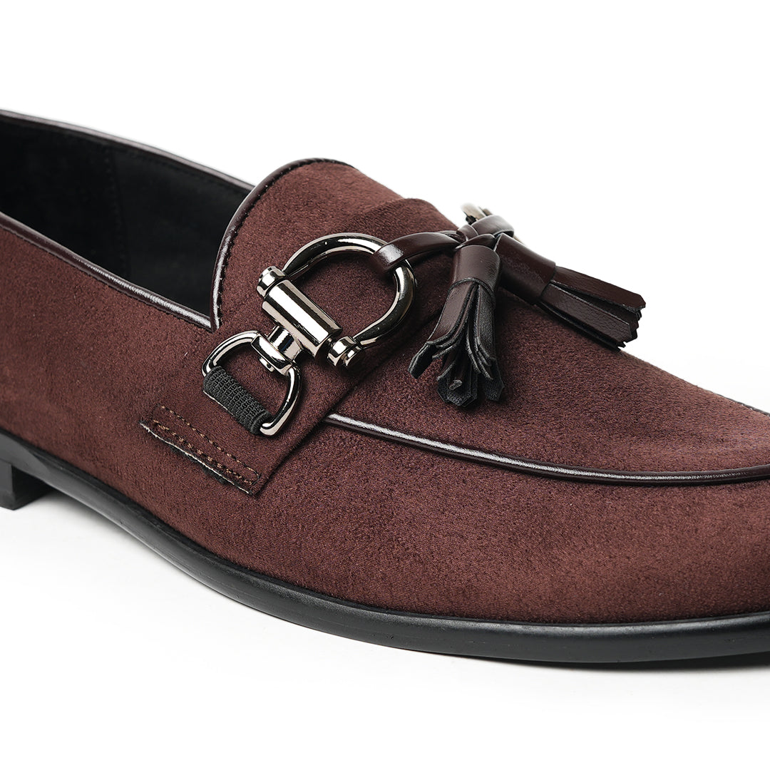 A timeless Monkstory brown loafer with tassels and a buckle, exuding modern sophistication.