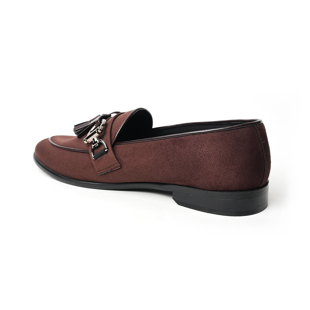 A timeless Monkstory brown loafer with tassels and a buckle, exuding modern sophistication.