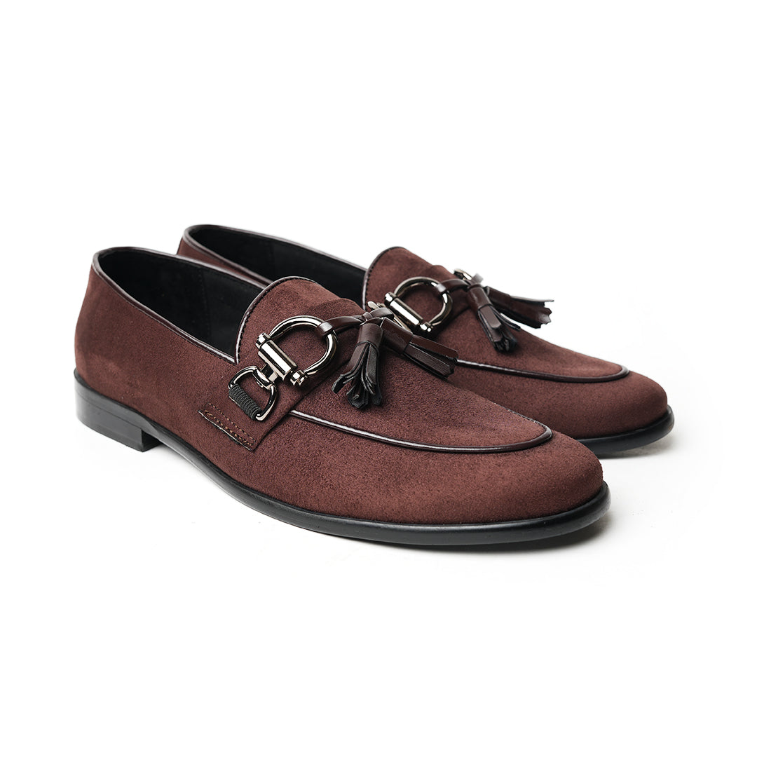 A timeless Monkstory brown loafer with tassels and a buckle, exuding modern sophistication.