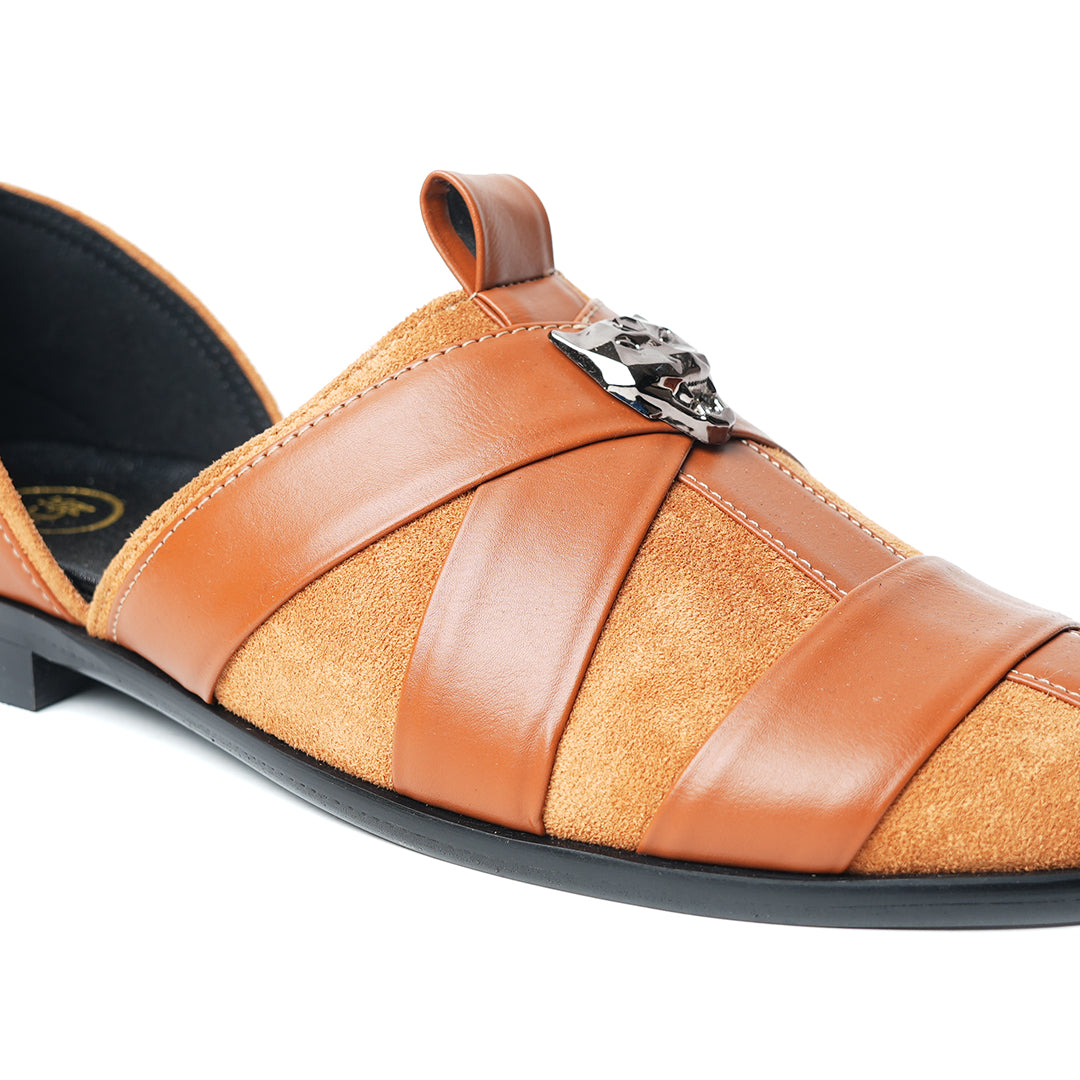 A pair of Monkstory Criss Cross Slip-On Sandal - Tan with an adjustable fit and vegan leather.