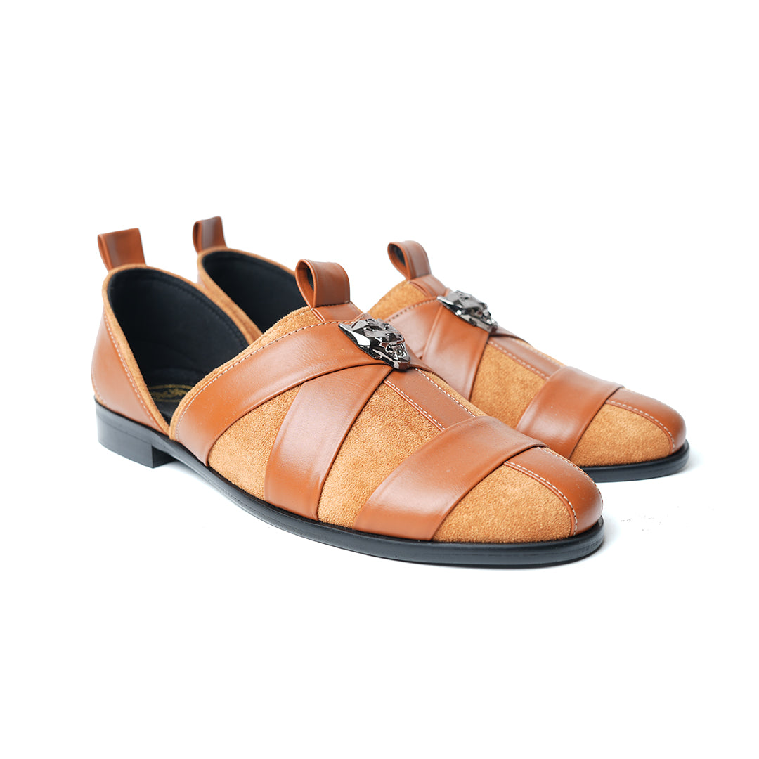 A pair of Monkstory Criss Cross Slip-On Sandal - Tan with an adjustable fit and vegan leather.