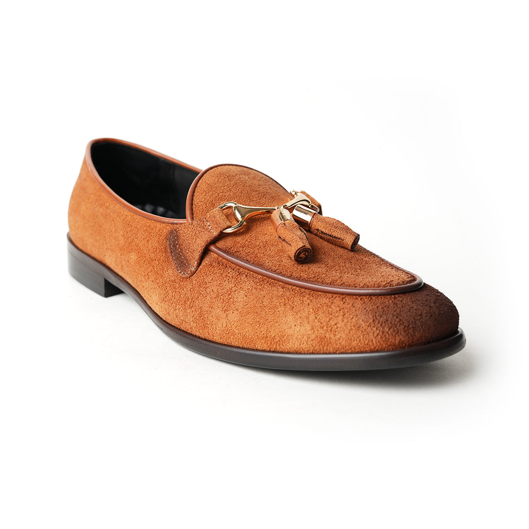 A rustic tan suede loafer, Monkstory Horse-bit Tasseled Slip-Ons - Rustic Tan, with timeless elegance.