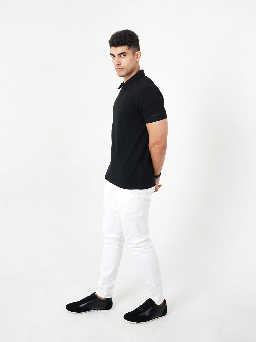 Monkstory young man posing in a Bamboo Cotton Zip-Polo Tee - Midnight Black.