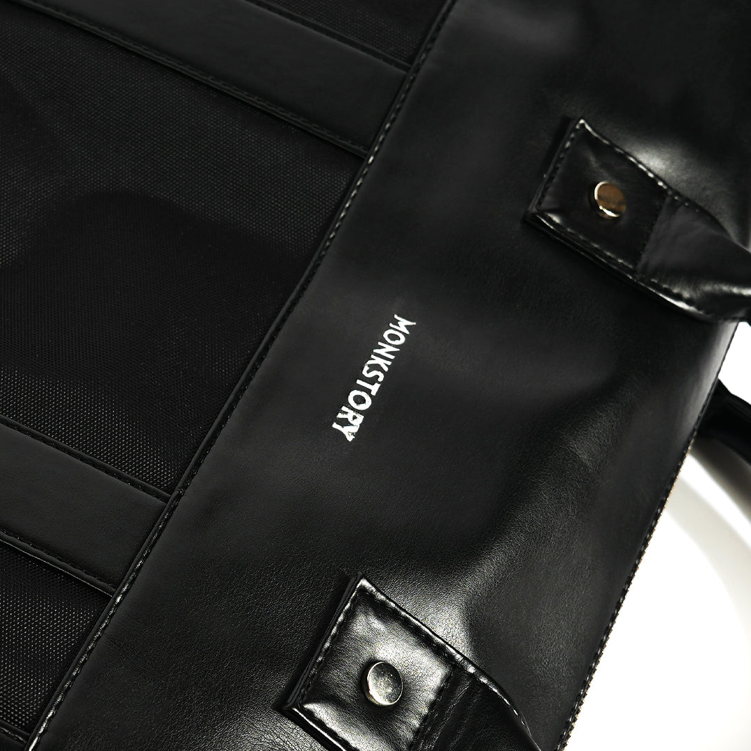 A Monkstory Timeless Laptop Bag - Black with storage options on a white background.