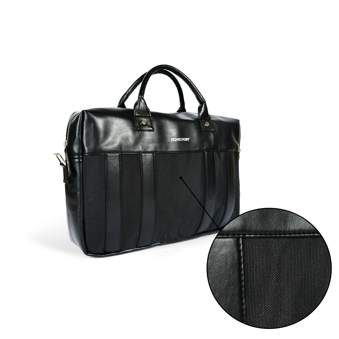 A Monkstory Timeless Laptop Bag - Black with storage options on a white background.