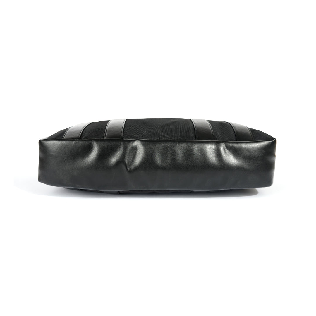 A Monkstory Timeless Laptop Bag - Black with storage options on a white background.