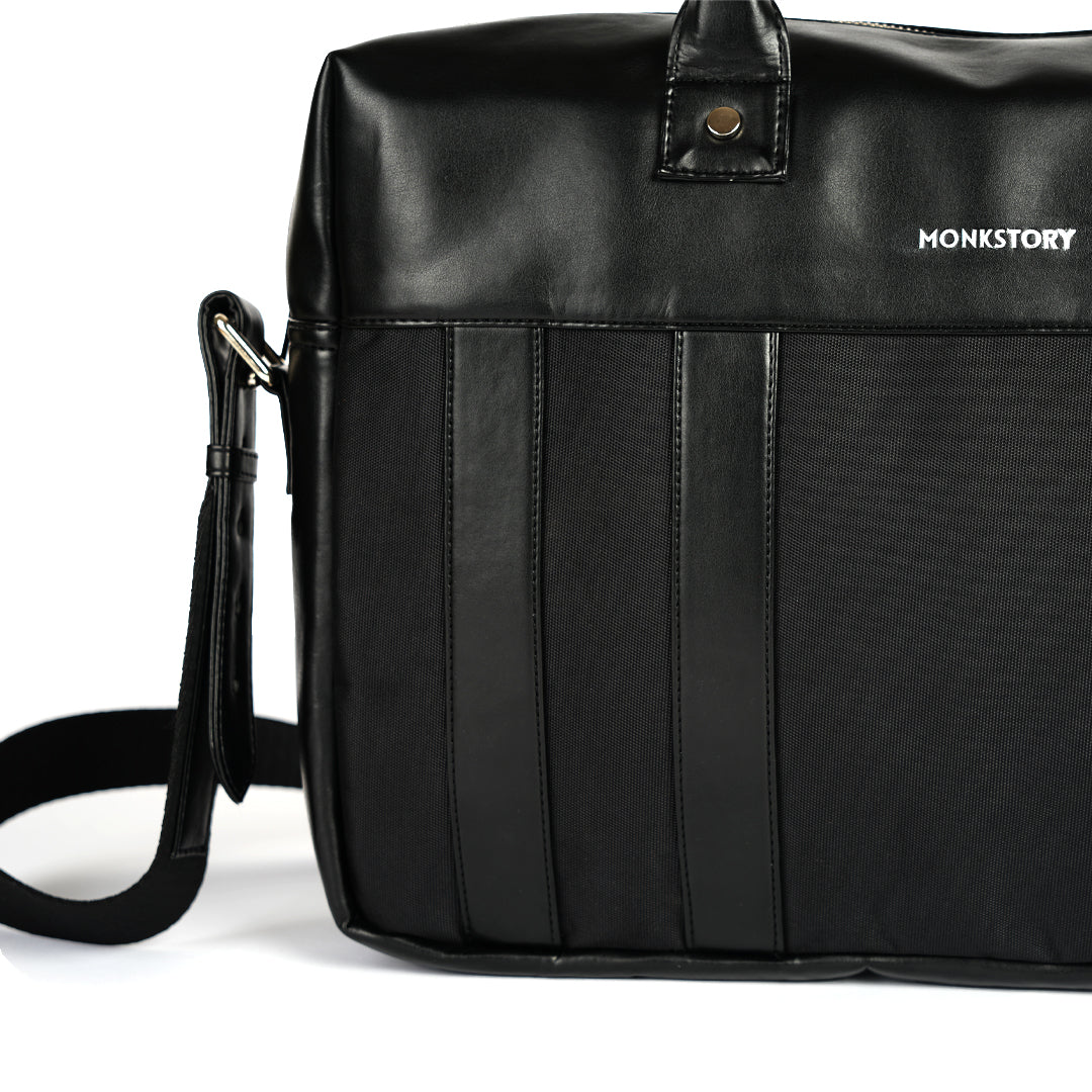 A Monkstory Timeless Laptop Bag - Black with storage options on a white background.