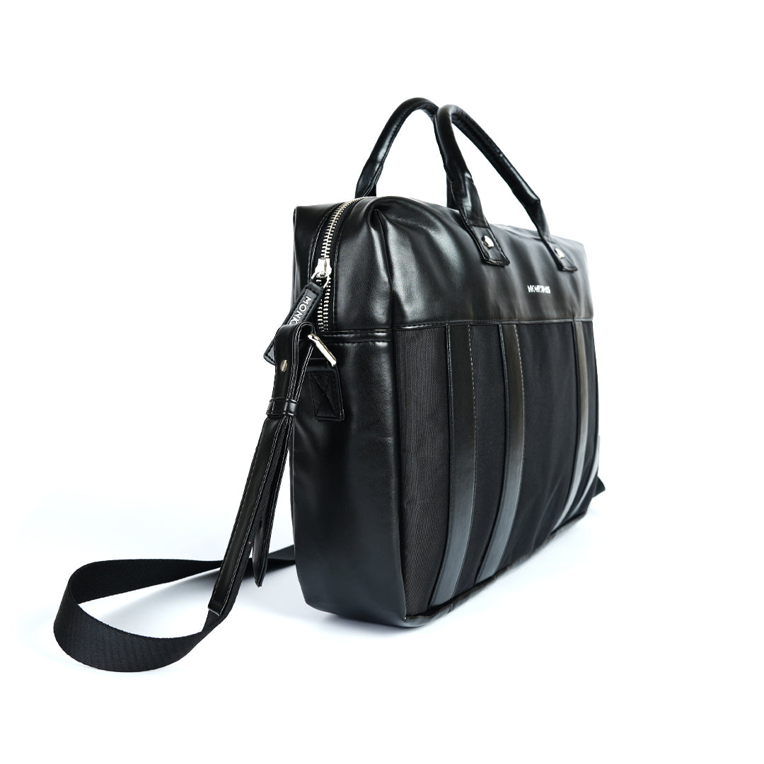 A Monkstory Timeless Laptop Bag - Black with storage options on a white background.
