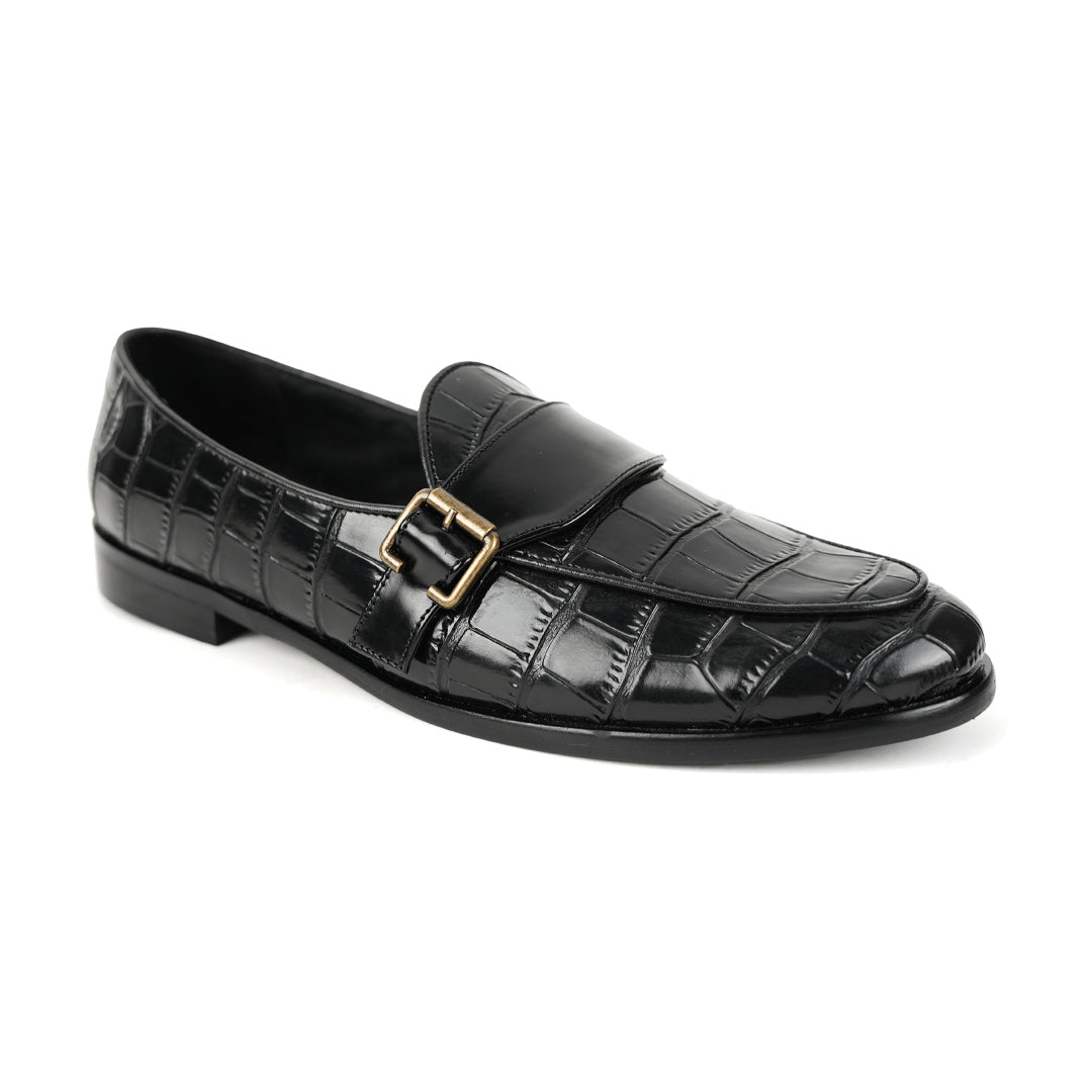 A sleek black Monkstory Croco Print Formal Shoes with a gold buckle.