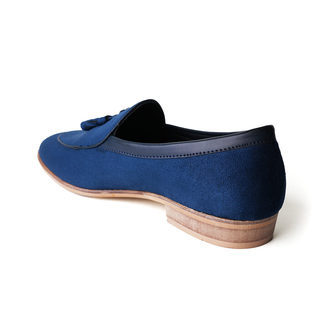 An eco-conscious blue suede Monkstory loafer with tassels, showcasing sustainability.