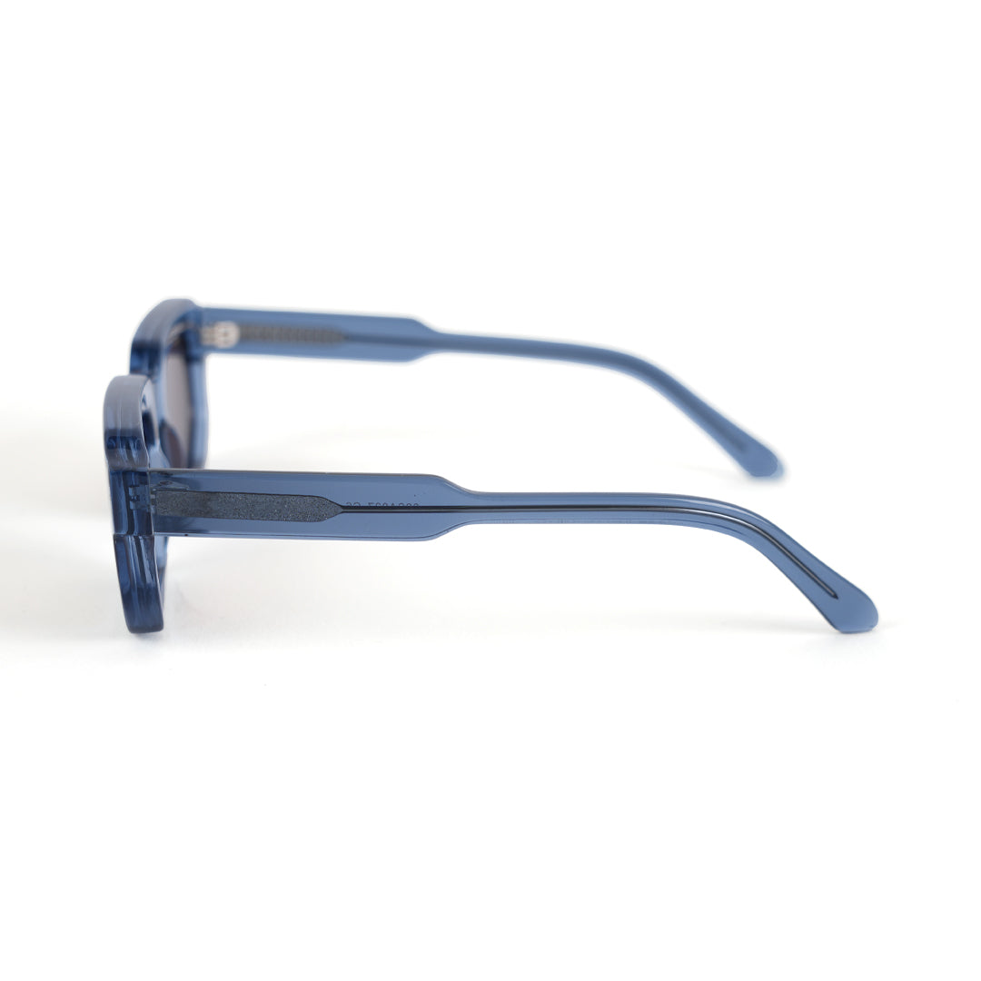 A pair of monkstory geometric acetate unisex sunglasses in transparent blue with brown lenses offering UV 400 protection.