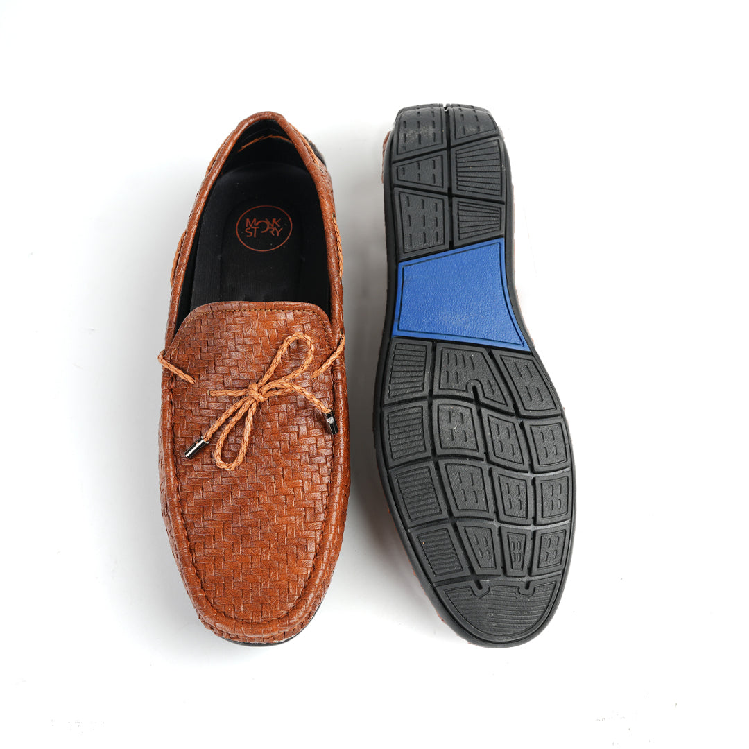 A fashionable men's Monkstory brown loafer with tassels, combining style and comfort.