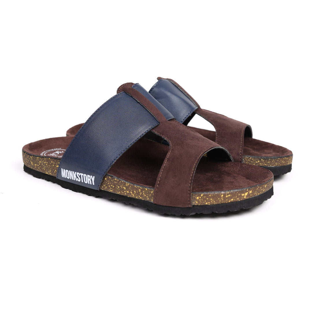 A pair of brown and blue Monkstory Cork Cross-Strap Sandals on a white background.