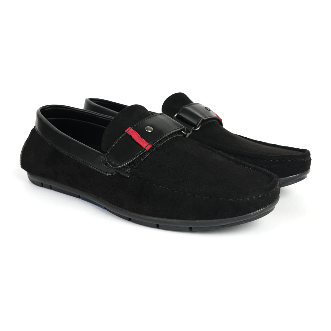 A comfortable Monkstory black loafer with a red stripe, perfect for driving.