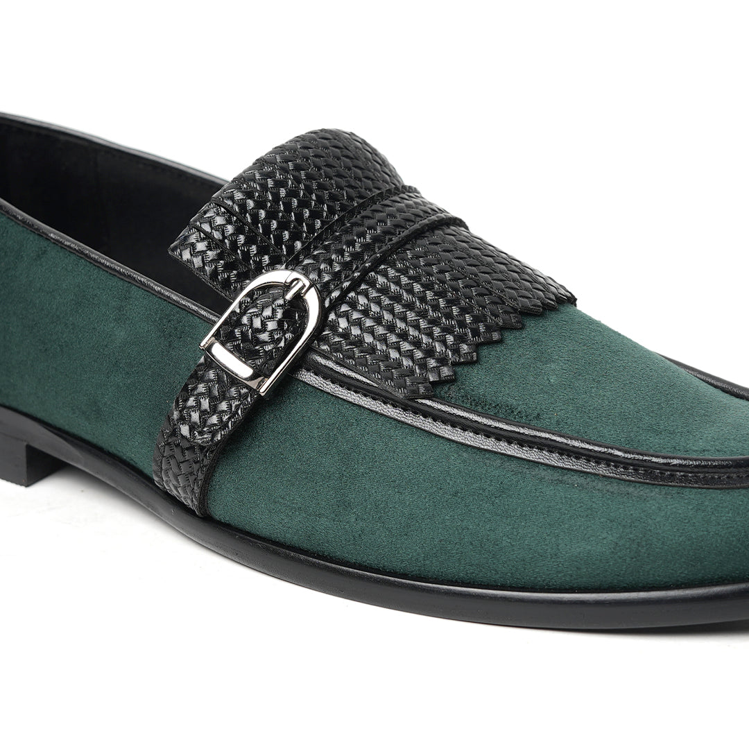 A Monkstory woven fringed slip-on with a bottle green suede and black buckle.