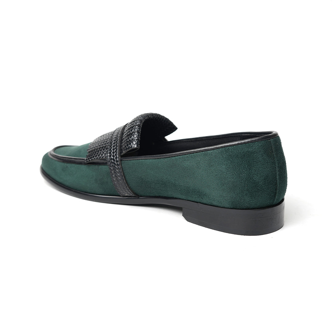 A Monkstory woven fringed slip-on with a bottle green suede and black buckle.