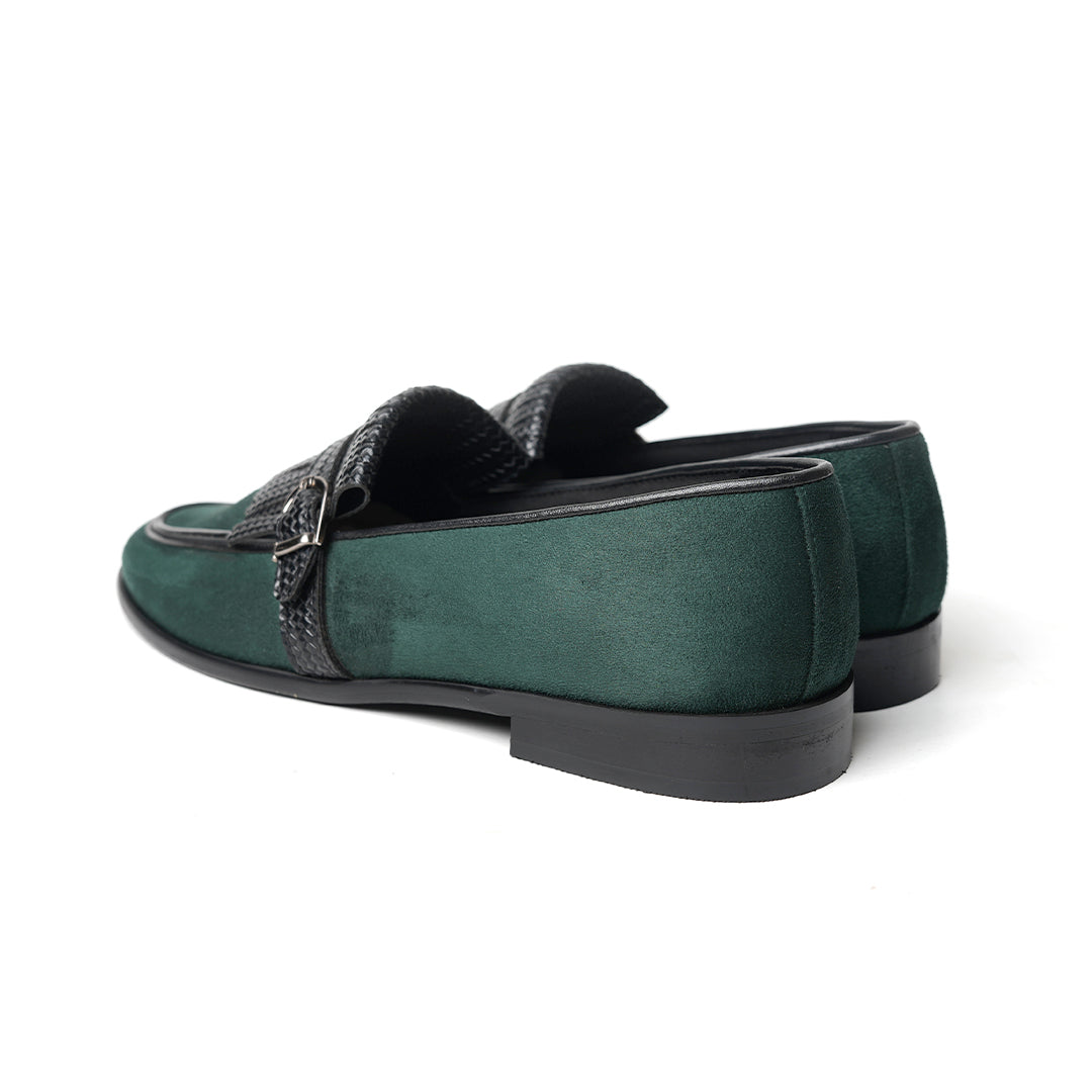A Monkstory woven fringed slip-on with a bottle green suede and black buckle.