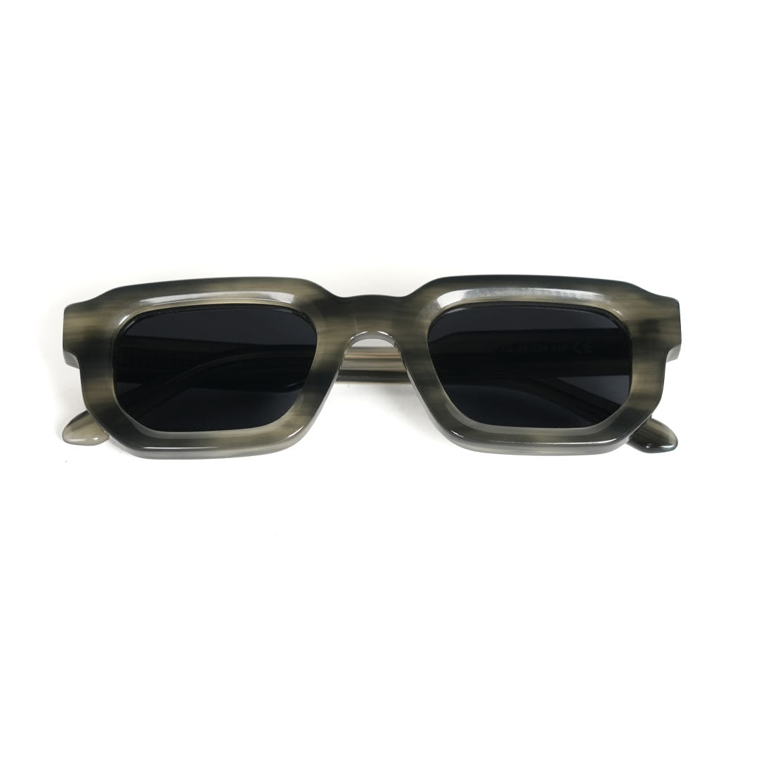 Monkstory sunglasses with a Marbleous Olive Grey frame and black lenses.