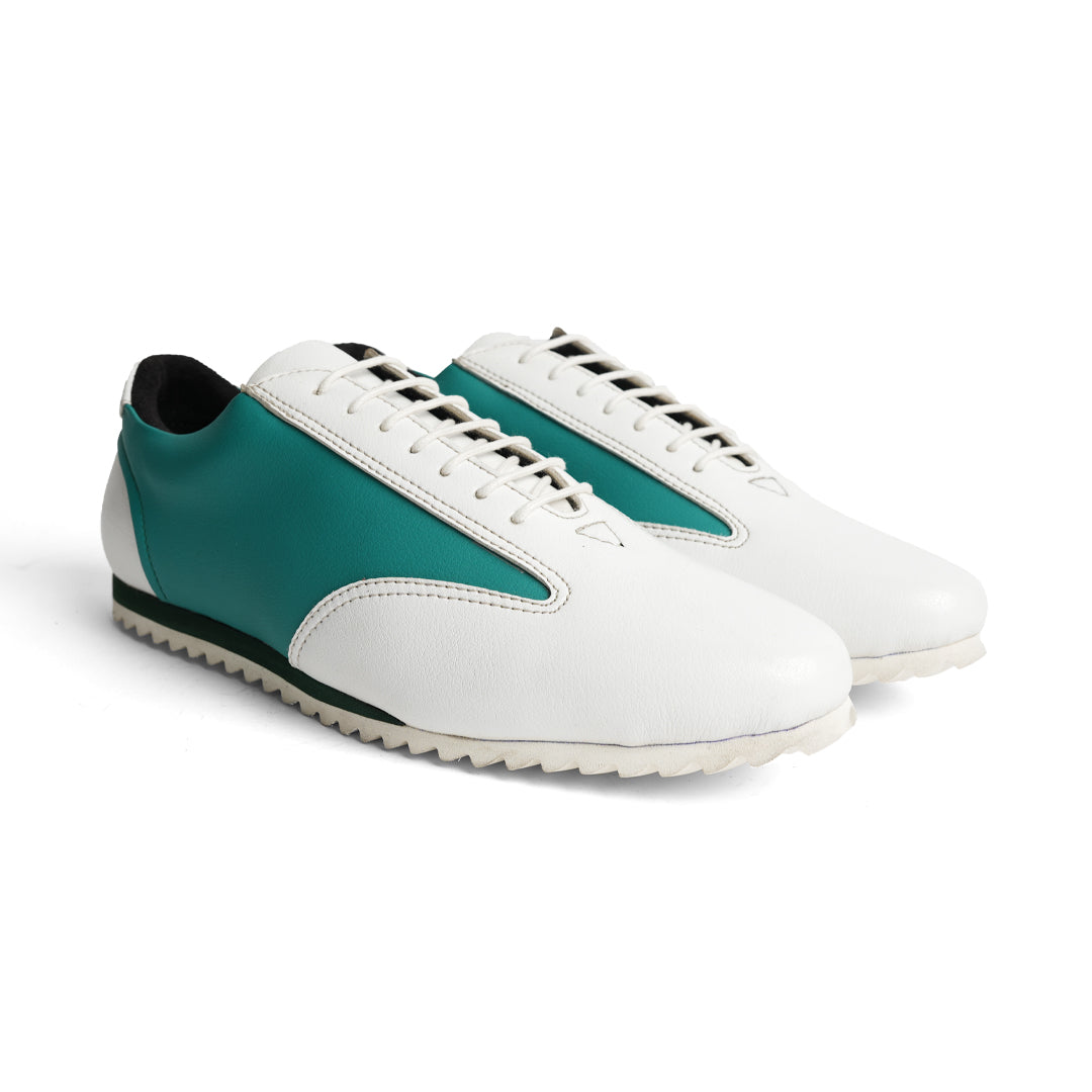 The Monkstory Dual Colour Smart Sneakers, in Teal Green & White, are a stylish and comfortable option for anyone in search of a sneaker with a white sole.