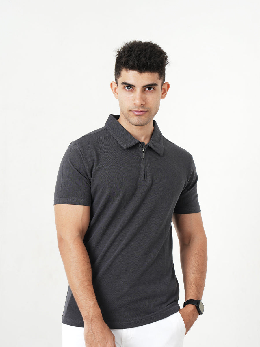 A man wearing a Monkstory Bamboo Cotton Zip-Polo Tee - Iron Grey shirt.