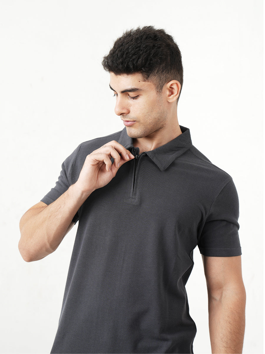 A man wearing a Monkstory Bamboo Cotton Zip-Polo Tee - Iron Grey shirt.