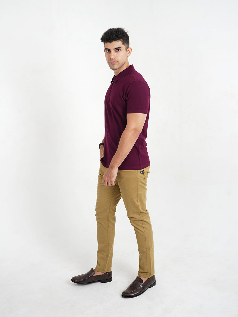 A man wearing a Monkstory Bamboo Cotton Zip-Polo Tee in Mauve Wine shade.