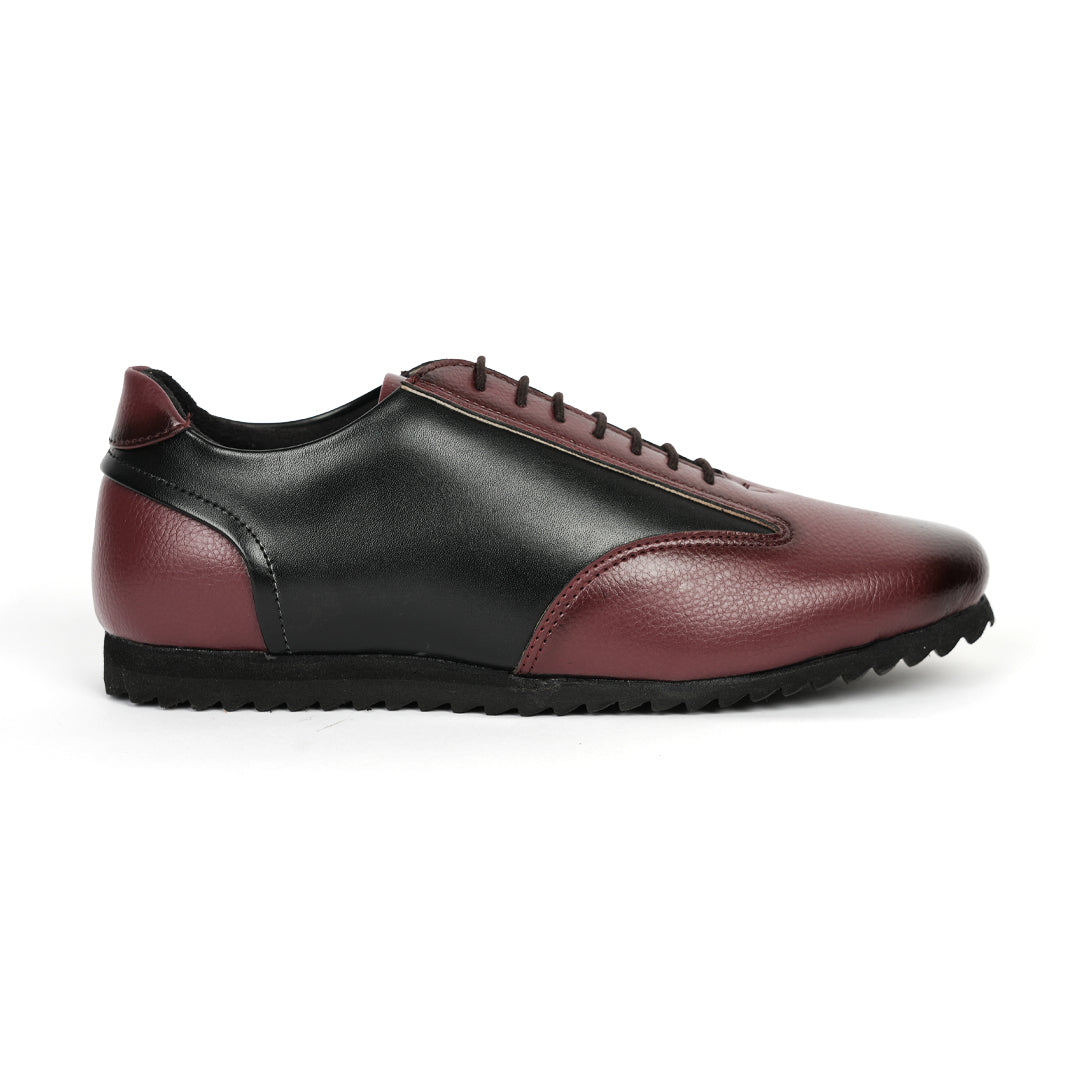 A fashionable Monkstory Dual Colour Smart Sneaker in burgundy and black leather that offers comfort.