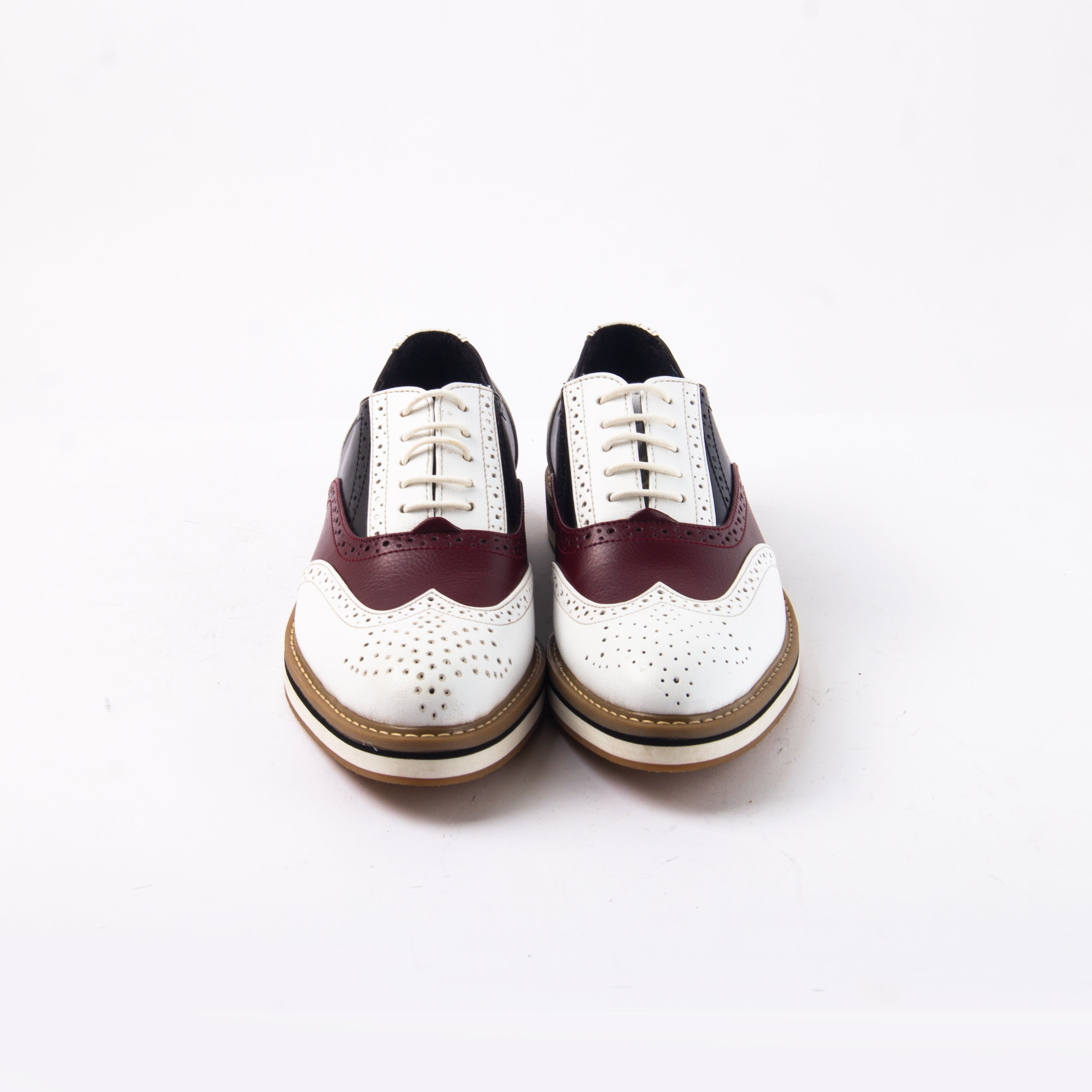 A white and burgundy wingtip oxford shoe that showcases Beverly Tricolour Brogues' design sensibilities with a touch of drama, from monkstory.