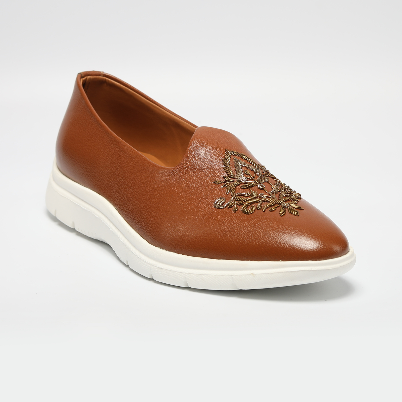 An ethnic design ReMx Mojari Sneakers - Tan with embroidered detailing, perfect for a festive occasion by Monkstory.