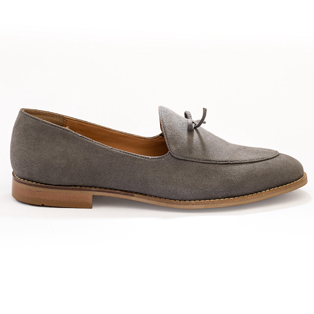 A Wyld faux-suede slip-on loafer with a tassel on the toe made from vegan leather - pastel grey by monkstory.