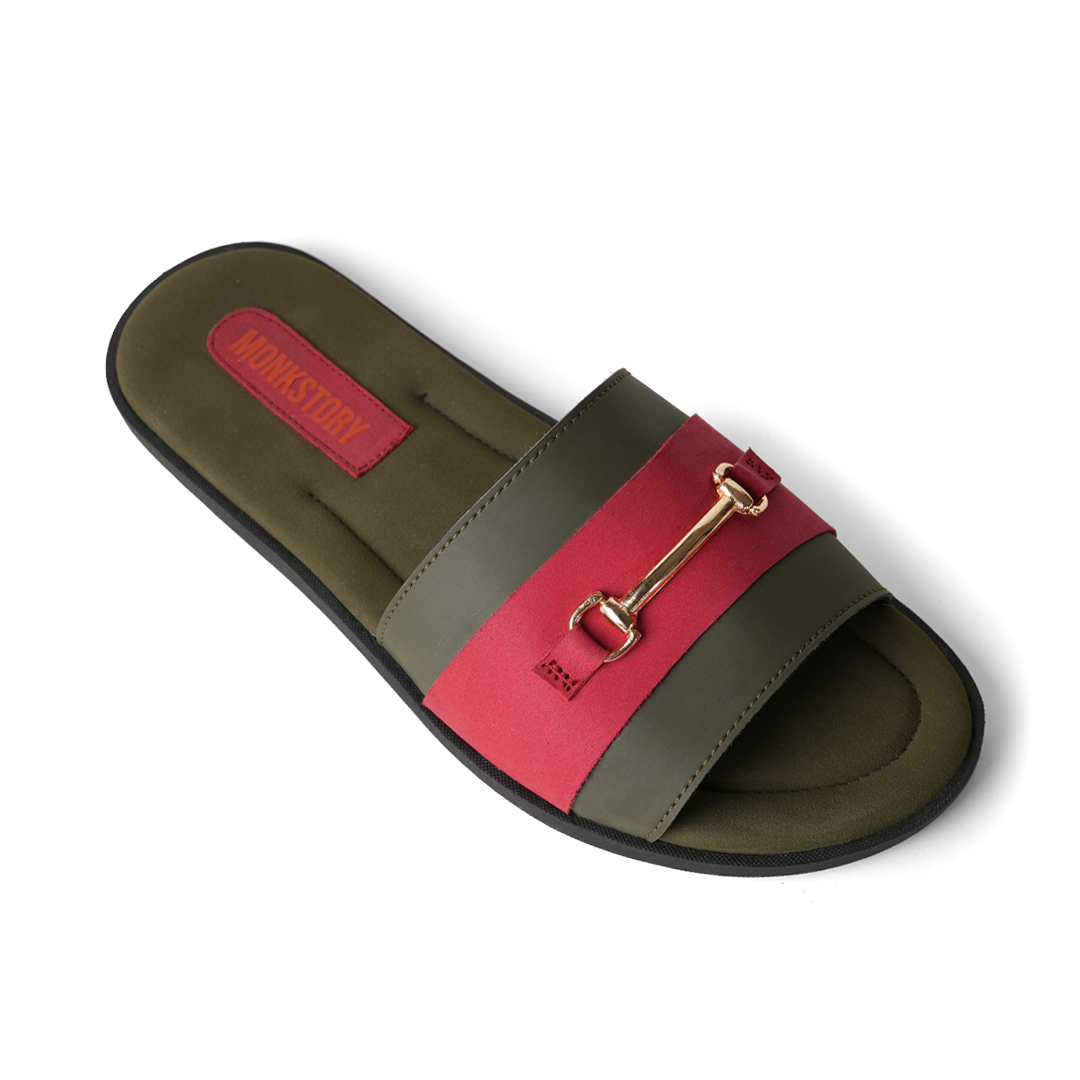These stylish Horsebit Slides - Red from Monkstory feature a red and green color combination, adorned with gold buckles for added elegance. Offering both comfort and trendy aesthetics, they are perfect for casual outings or lounging by.