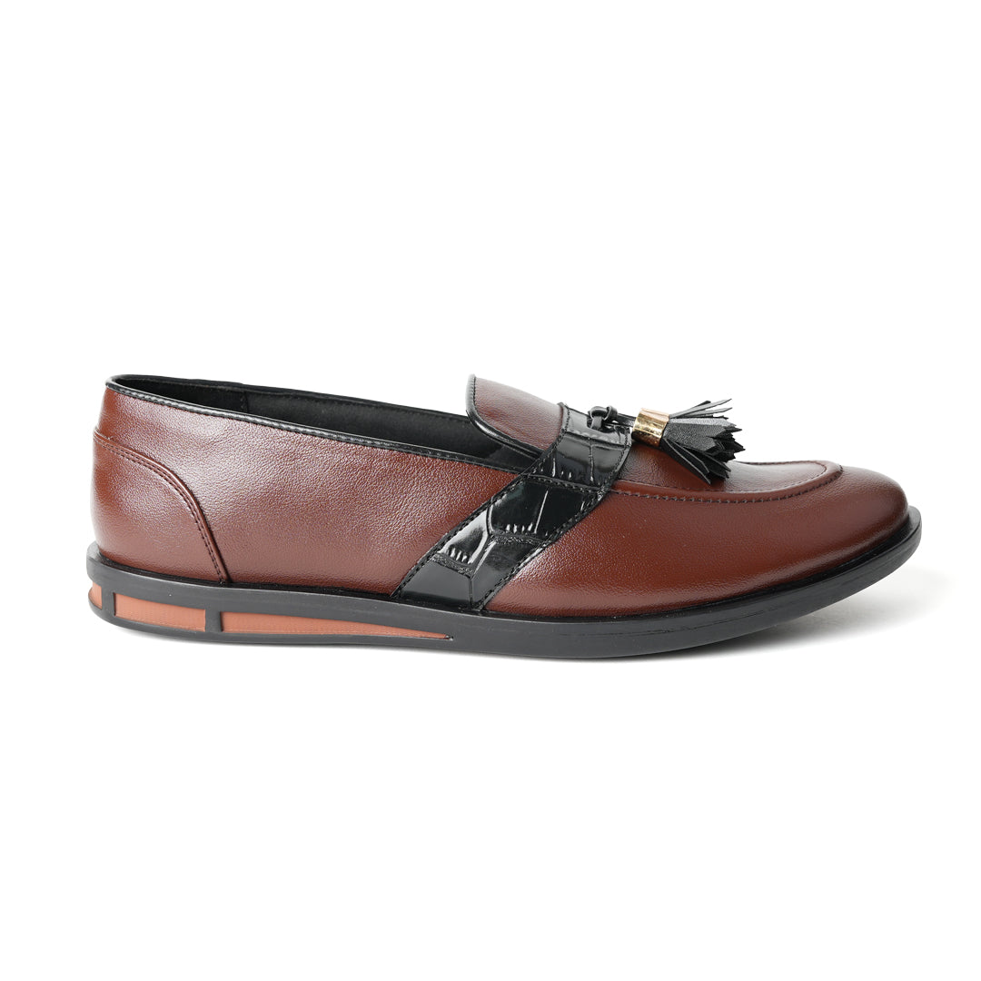 Flatform Metallic Tassel Slip Ons - Brown, by Monkstory, are a pair of loafers with faux leather.