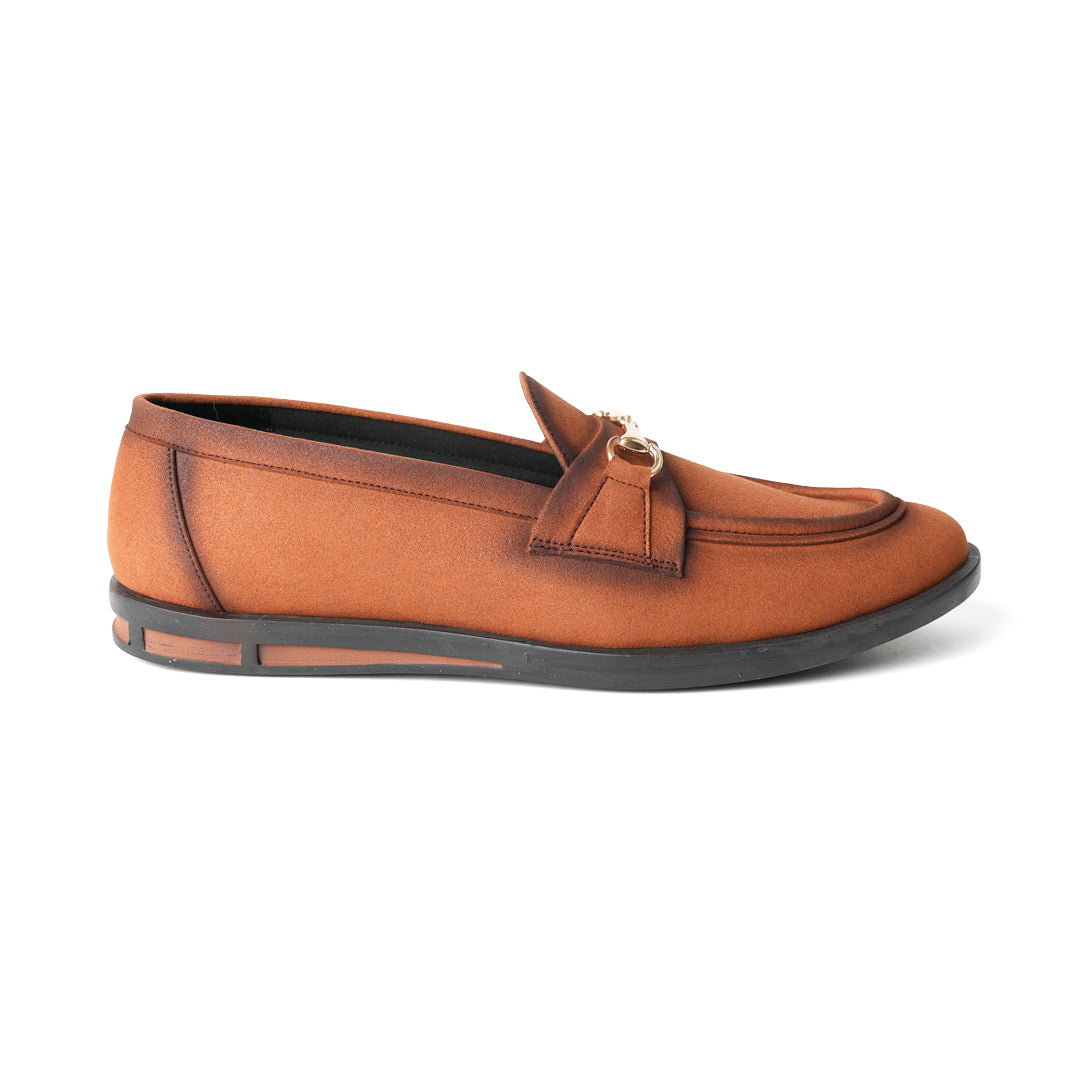 A pair of Flatform Suede Horsebit Slip Ons - Burnish Brown loafers with a gold buckle from Monkstory.