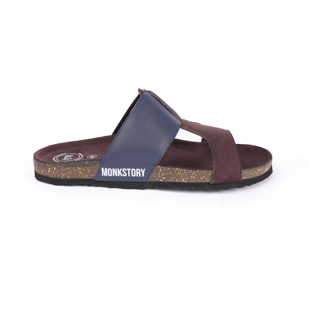 A pair of brown and blue Monkstory Cork Cross-Strap Sandals on a white background.