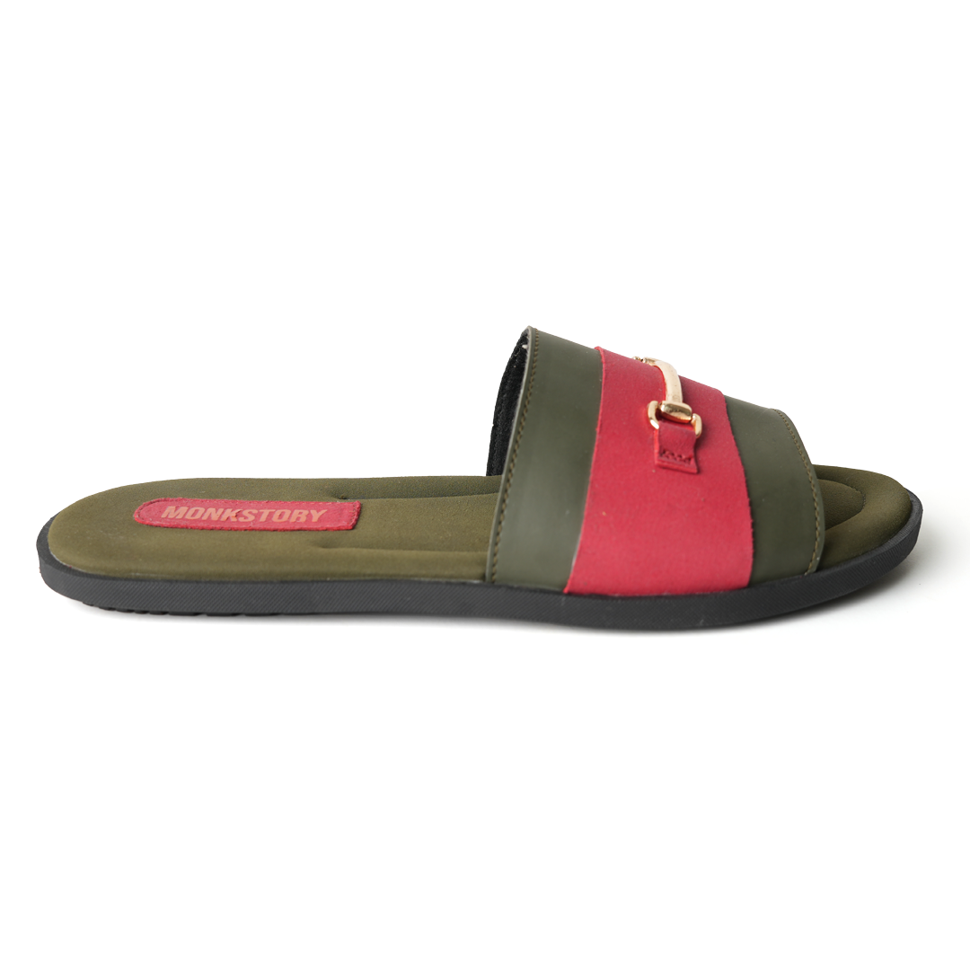 These stylish Horsebit Slides - Red from Monkstory feature a red and green color combination, adorned with gold buckles for added elegance. Offering both comfort and trendy aesthetics, they are perfect for casual outings or lounging by.