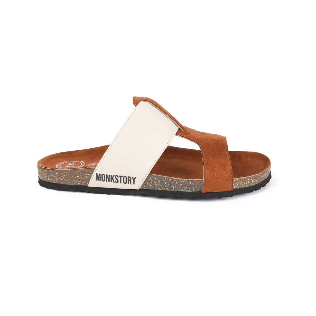 A pair of tan and cream Monkstory Cork Cross-Strap Sandals on a white background.