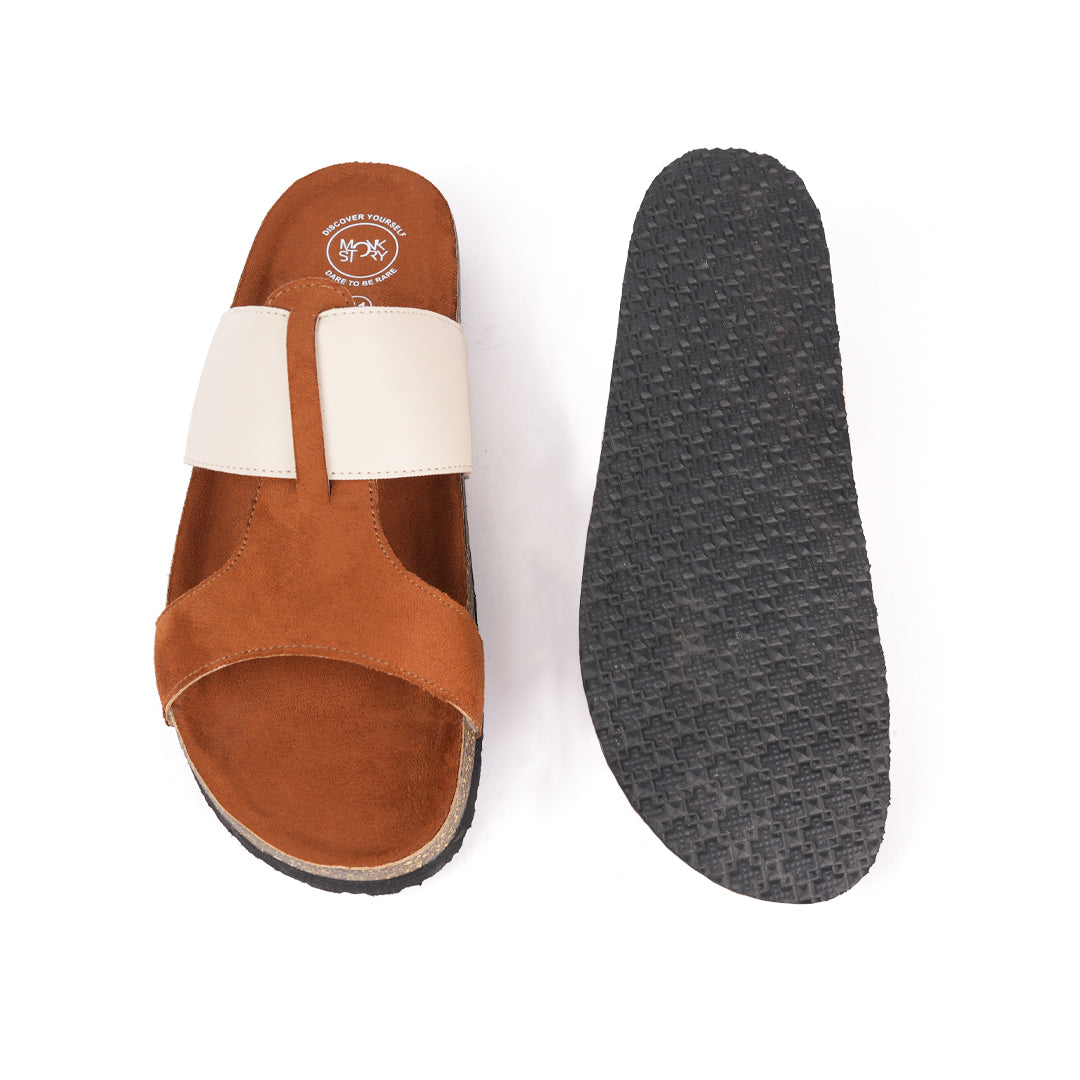 A pair of tan and cream Monkstory Cork Cross-Strap Sandals on a white background.