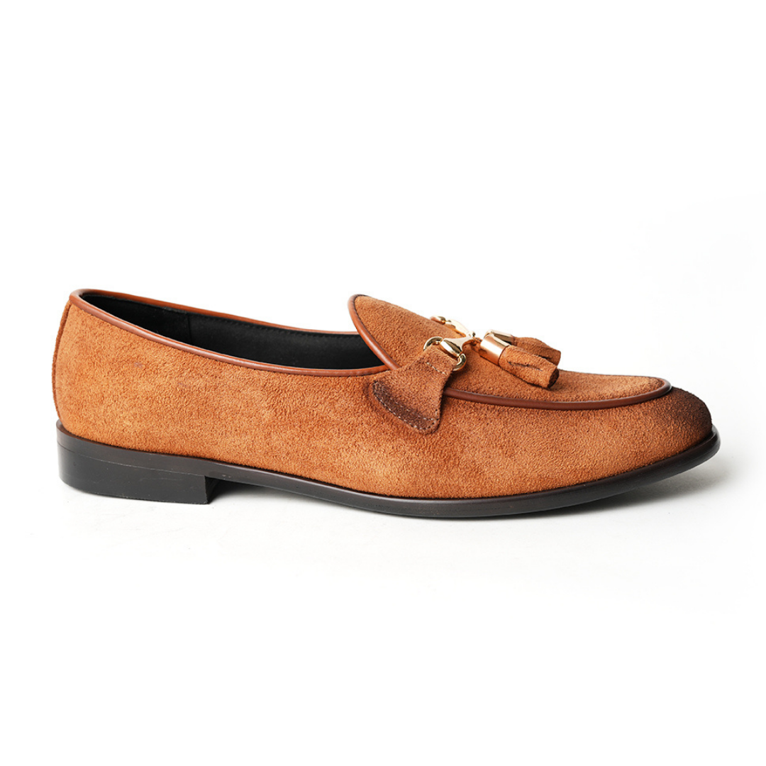 A rustic tan suede loafer, Monkstory Horse-bit Tasseled Slip-Ons - Rustic Tan, with timeless elegance.