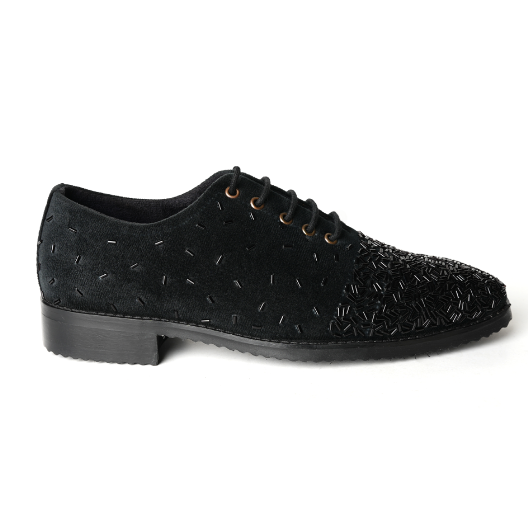 A stylish Monkstory Artisan Lace-Up - Black adorned with sequins, showcasing exquisite craftsmanship.