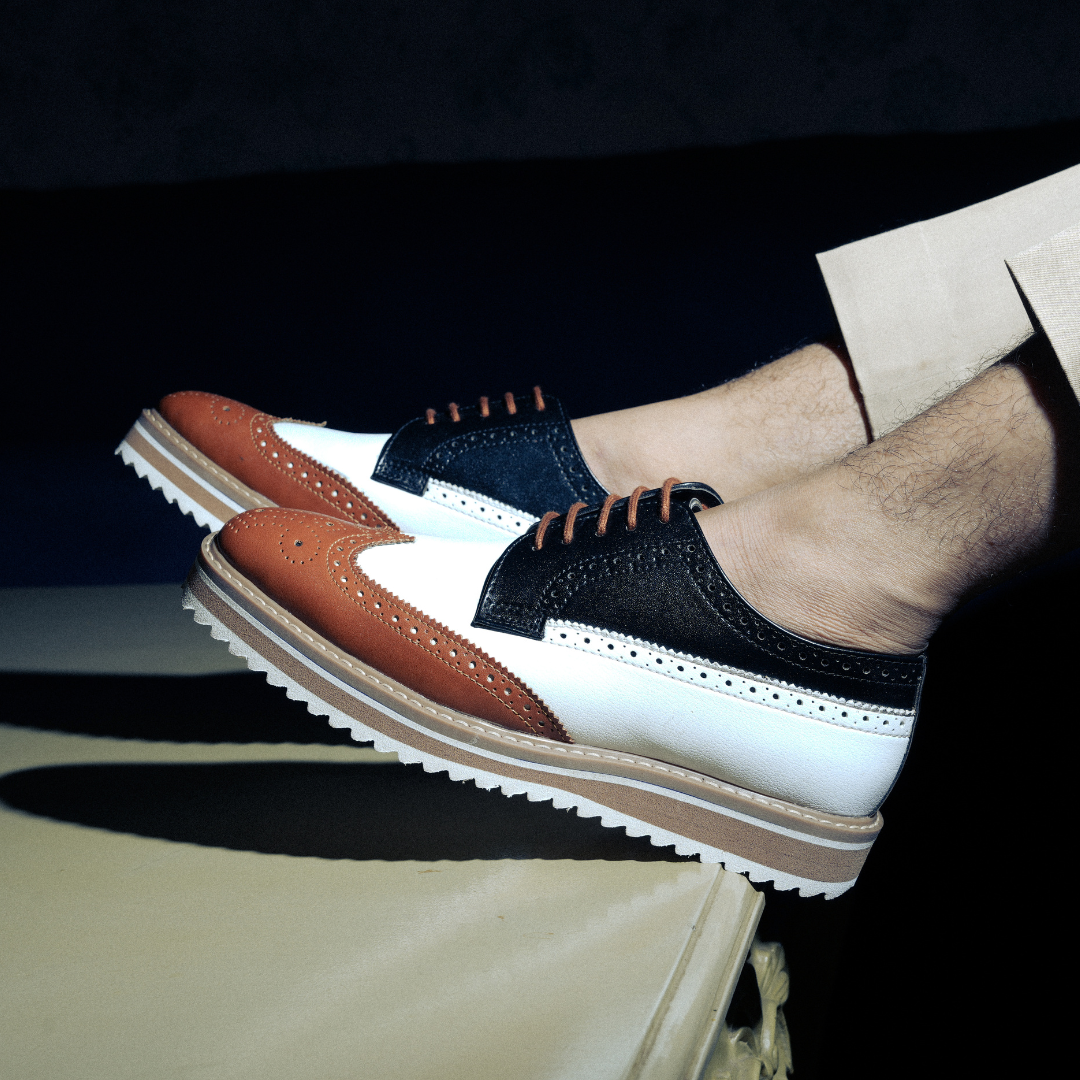 A trendy Monkstory Tricolour Brogues with a striking tricolor design.