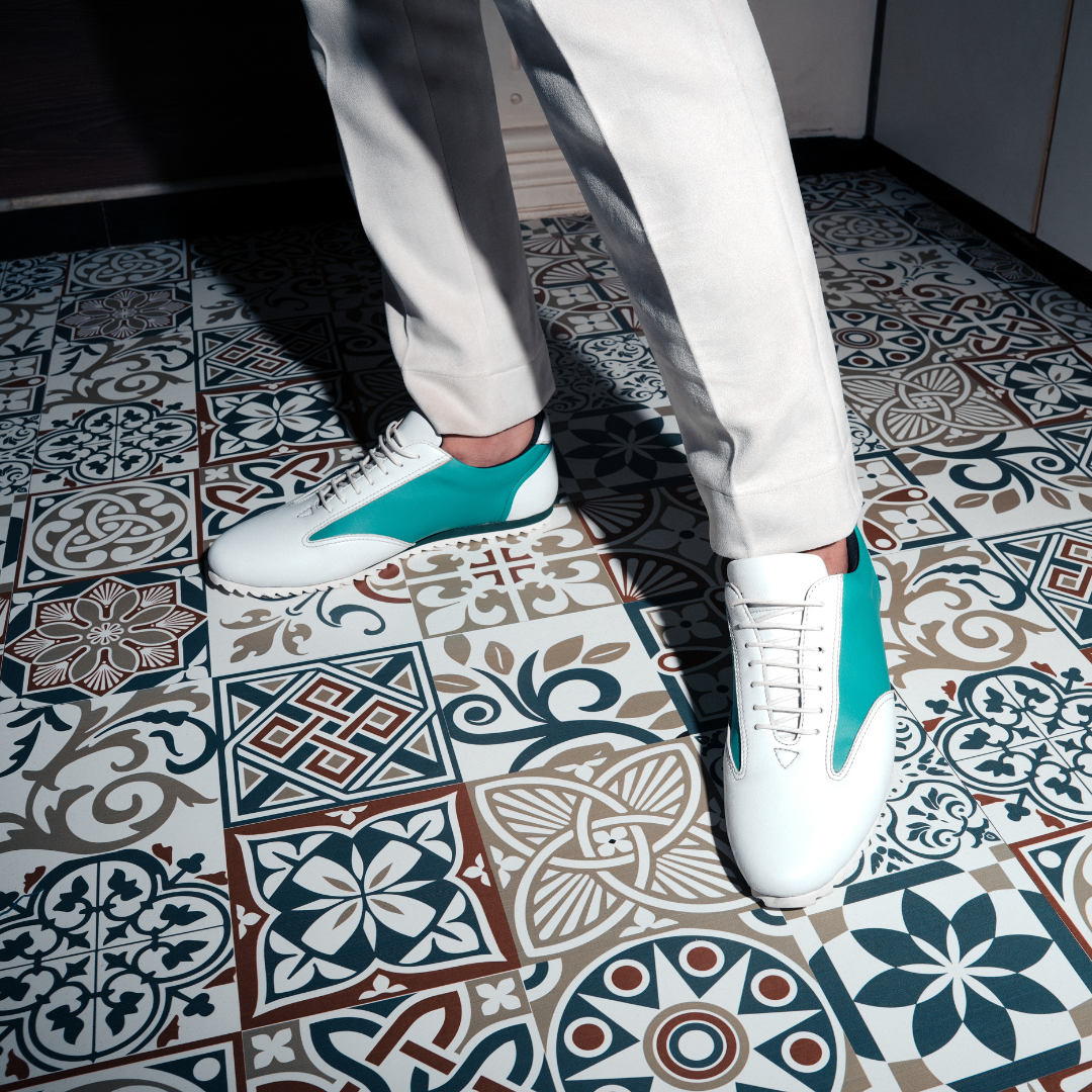 The Monkstory Dual Colour Smart Sneakers, in Teal Green & White, are a stylish and comfortable option for anyone in search of a sneaker with a white sole.
